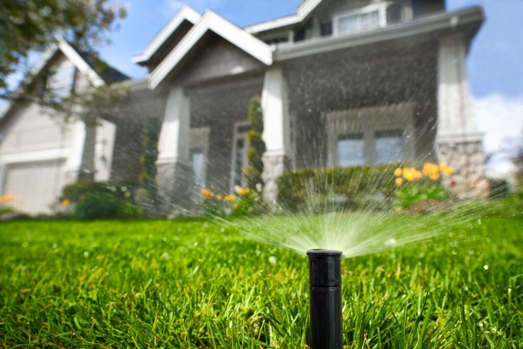 The rhythmic dance of the sprinklers as they watered the grass added a soothing element to the scene,